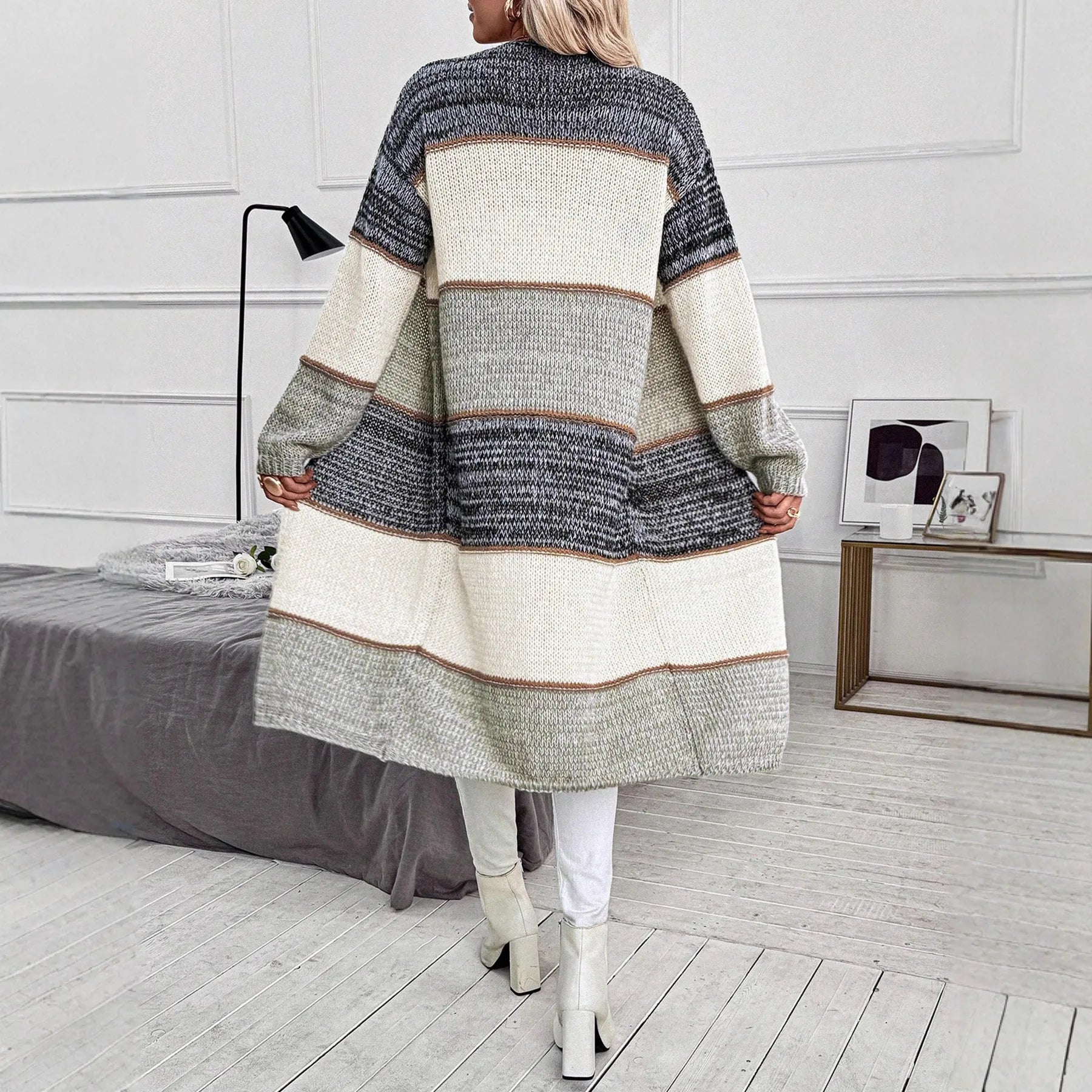 Grey stripes and plaid pattern on a women's loose fit knitted long cardigan with long sleeves.