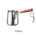 Stainless steel garland coffee cup with a scaled wooden handle shown in a simple, solid colour.