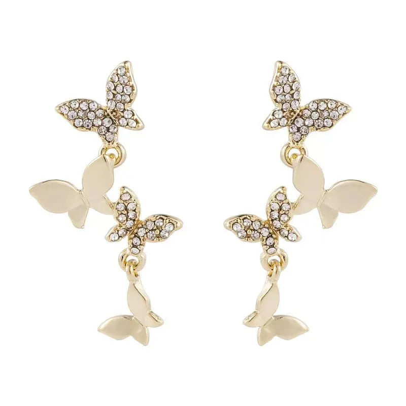 Gold coloured copper earrings with four butterfly design elements for women
