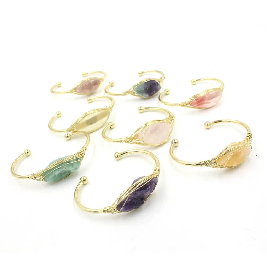 Natural raw gemstone bracelet with 8mm amorphous crystal beads on an adjustable open band.