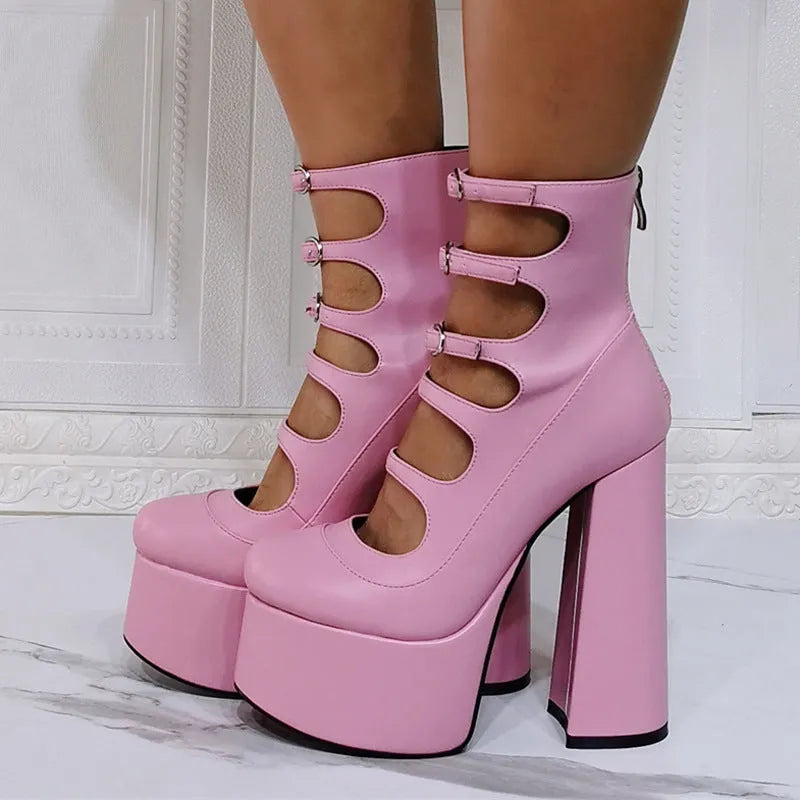 Black patent leather women's platform high heel boots with a thick heel and serpentine ankle buckle