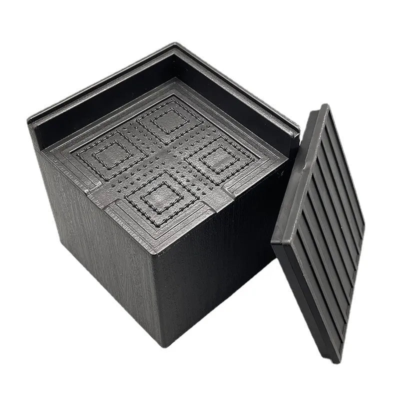 Four black thickened plastic furniture feet mats for height adjustment