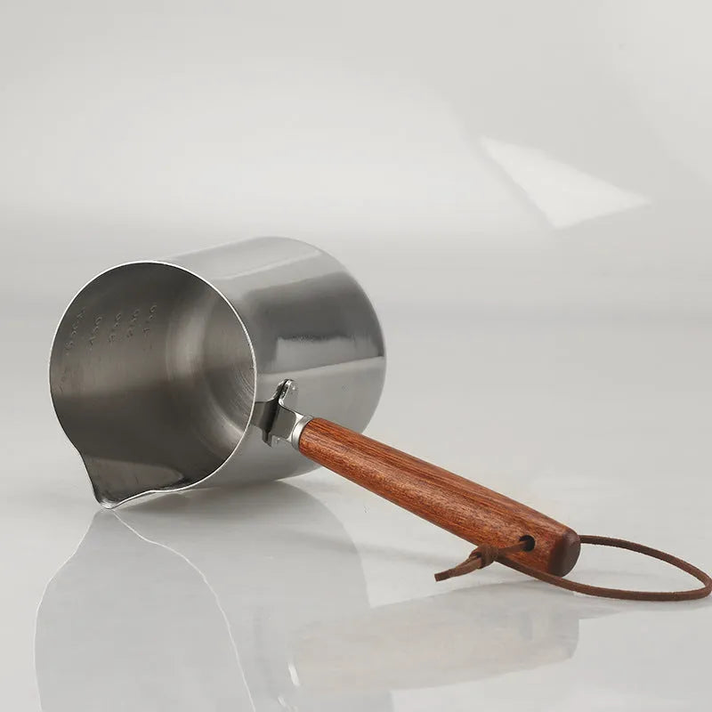Stainless steel garland coffee cup with a scaled wooden handle shown in a simple, solid colour.