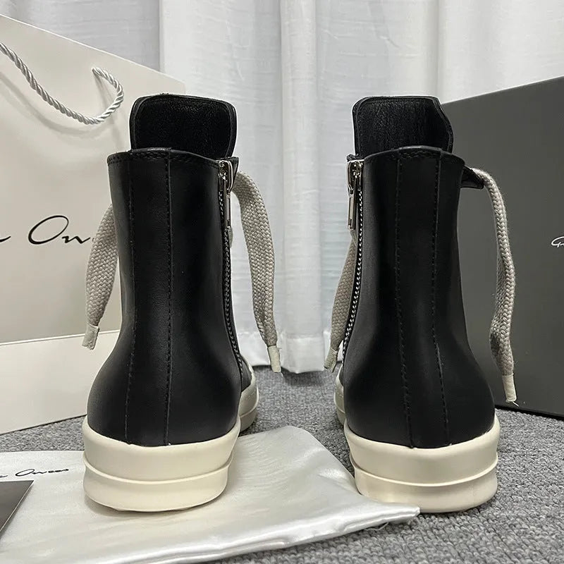Men's black high-top leather sneakers with a side zip on a white background