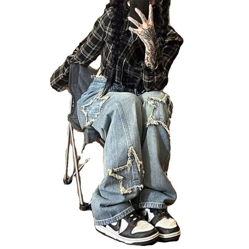Blue women's straight-leg jeans with a high waist on a hanger, showing the denim texture and cut.
