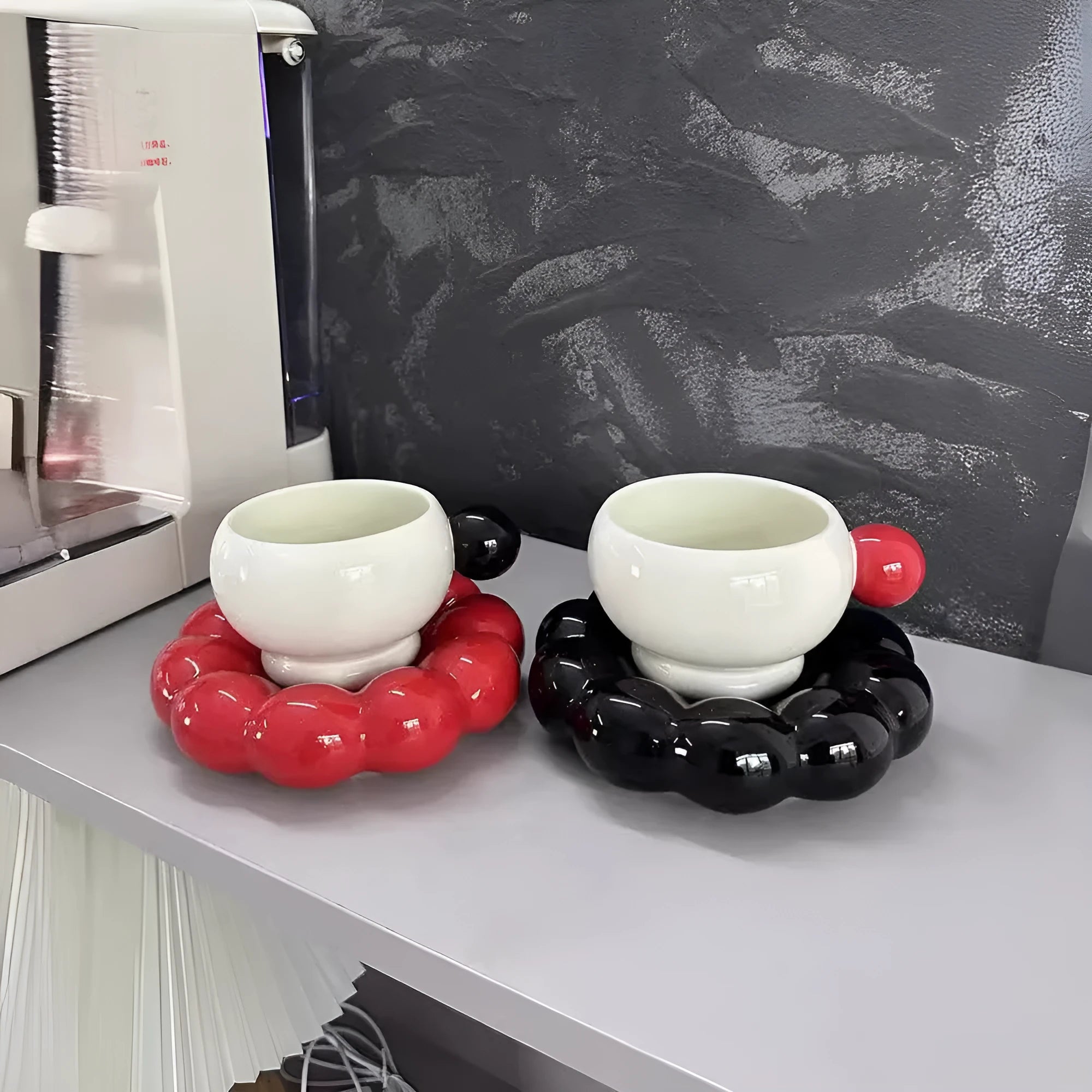 Ceramic coffee cup and dish set in a Nordic style, shown in a choice of solid colours.