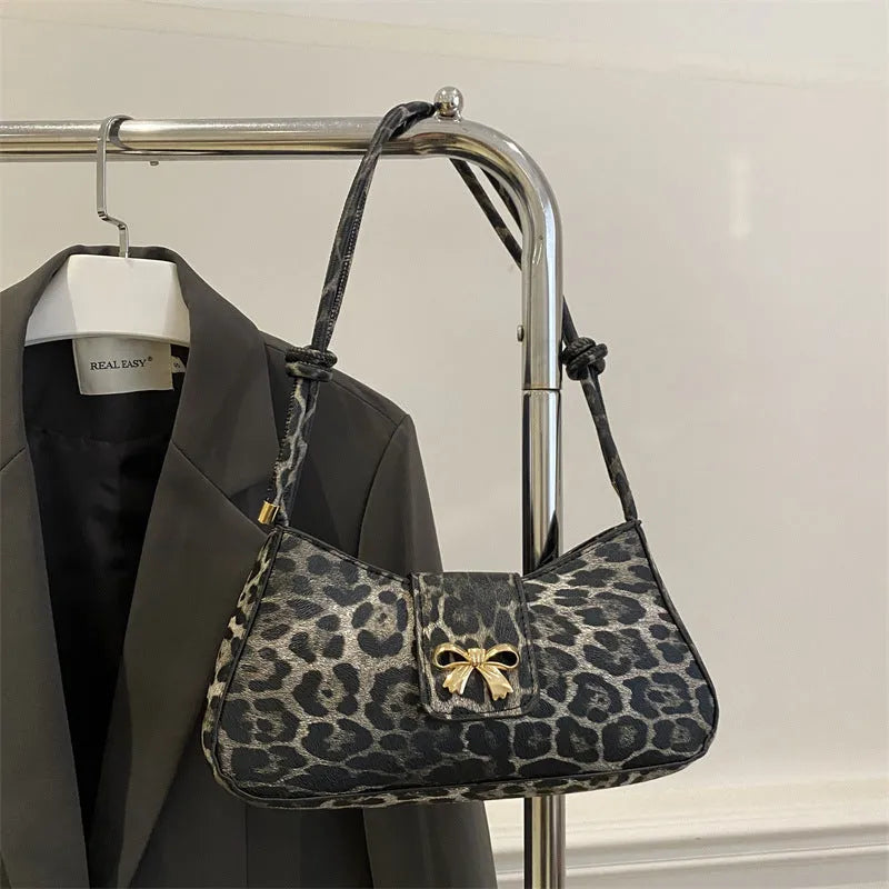 Large casual PU handbag for women in black, shown with sandwich pocket detail.