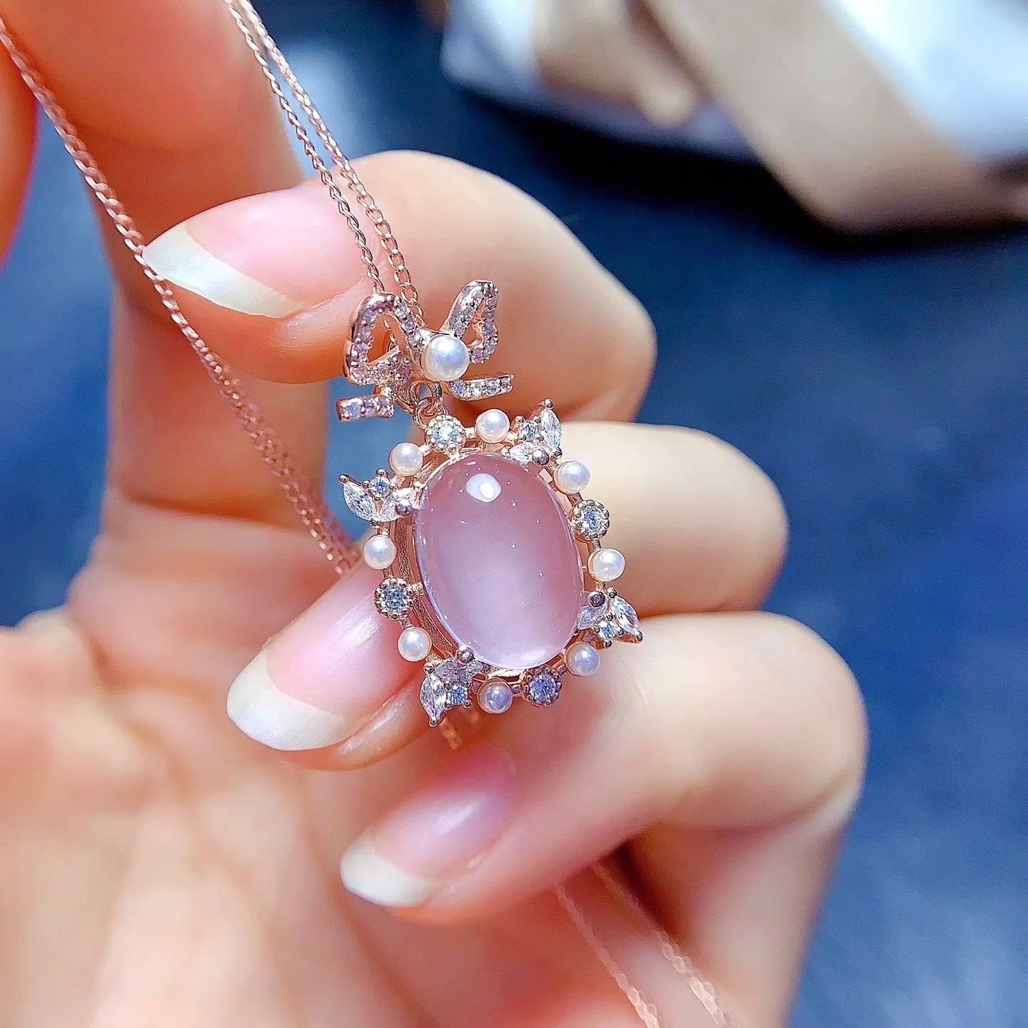 Geometric rose quartz pendant necklace on a silver chain with rose gold plating
