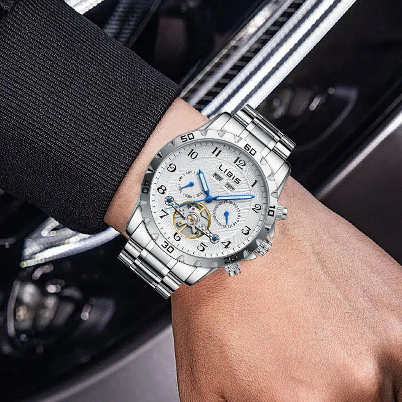 Silver men's automatic perpetual calendar watch with stainless steel band and sapphire glass.