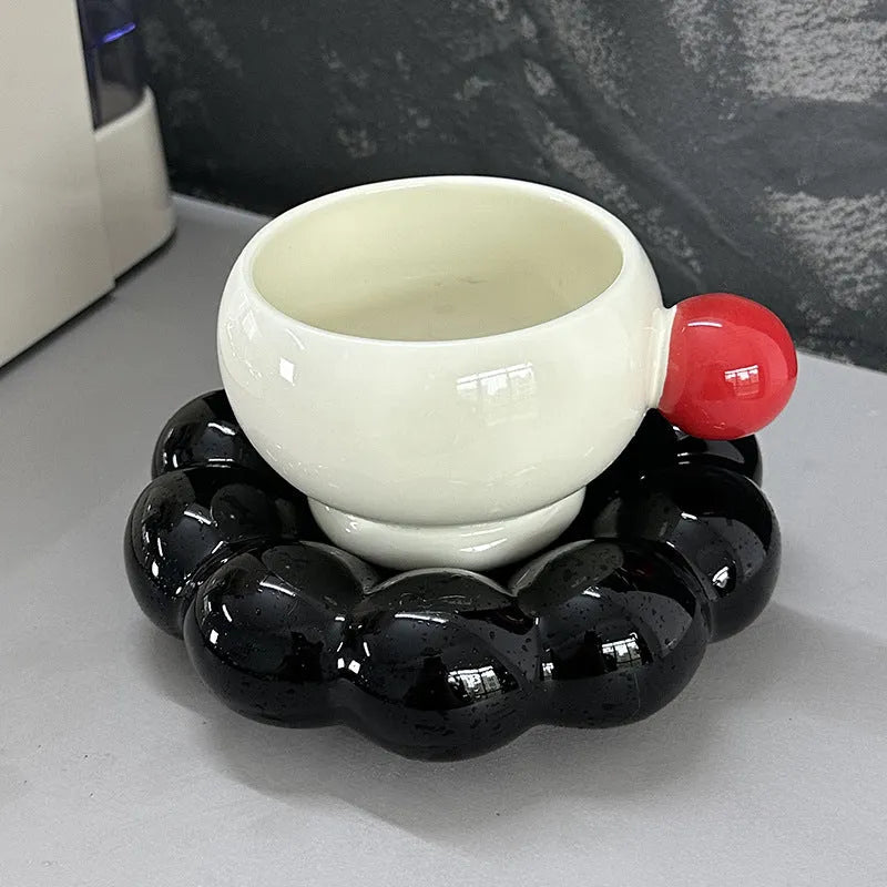 Ceramic coffee cup and dish set in a Nordic style, shown in a choice of solid colours.