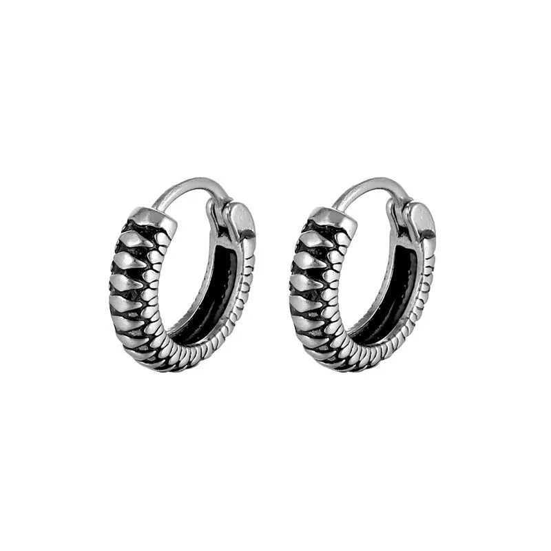 Silver geometric retro twist earrings with stripes made from titanium steel on a white background.