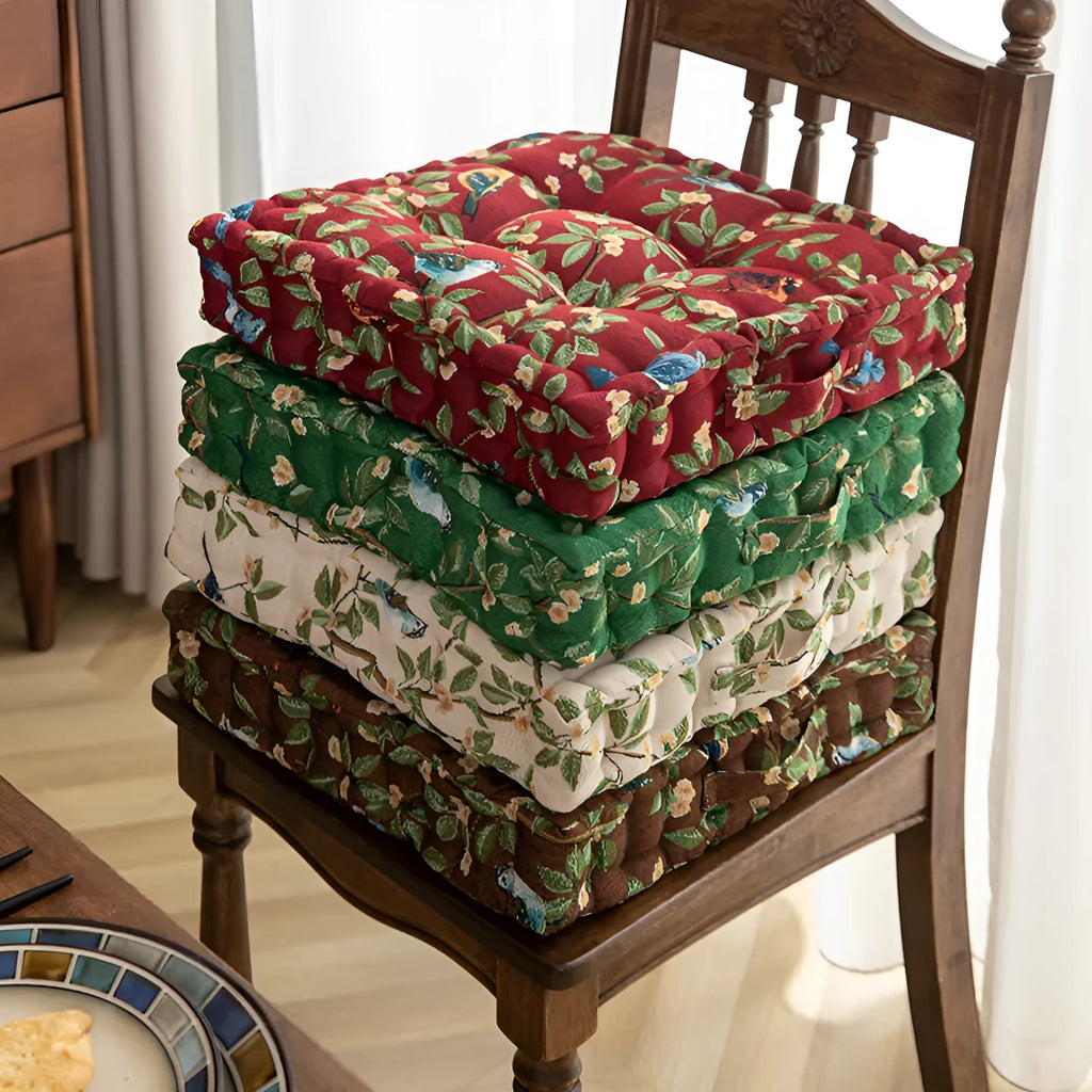 American-style square dining chair cushion for back support in apricot floral pattern.