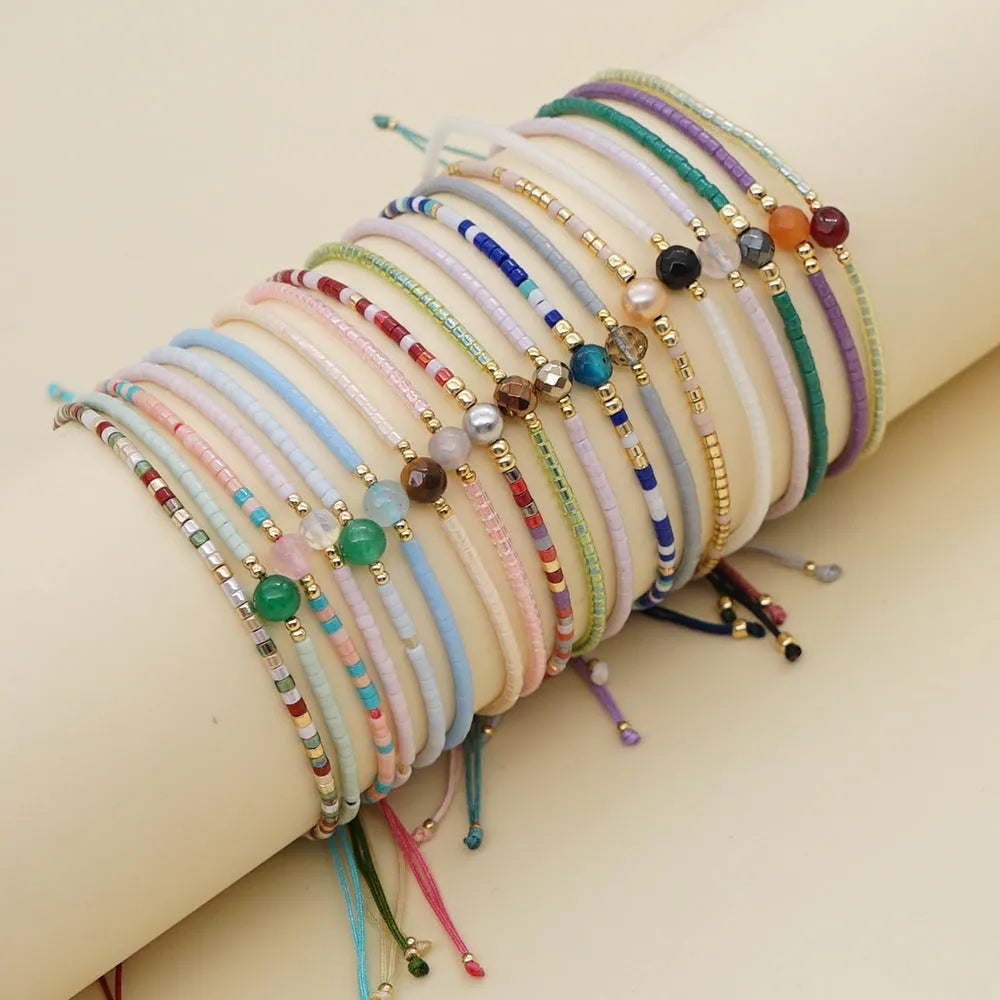 A colourful Bohemian style beaded bracelet with semi-precious stone and glass beads on an adjustable strap.