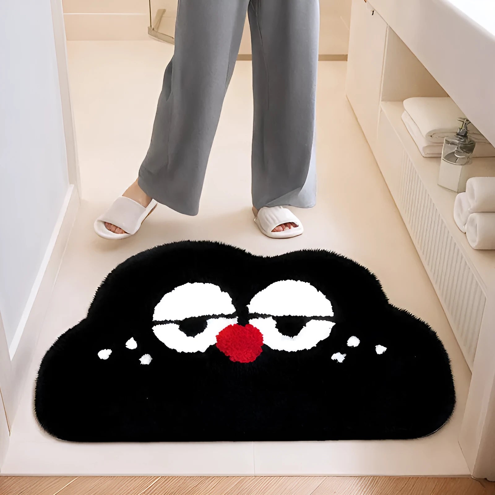 Cartoon anime patterned bathroom mat in soft colours, available in multiple sizes on a bathroom floor.