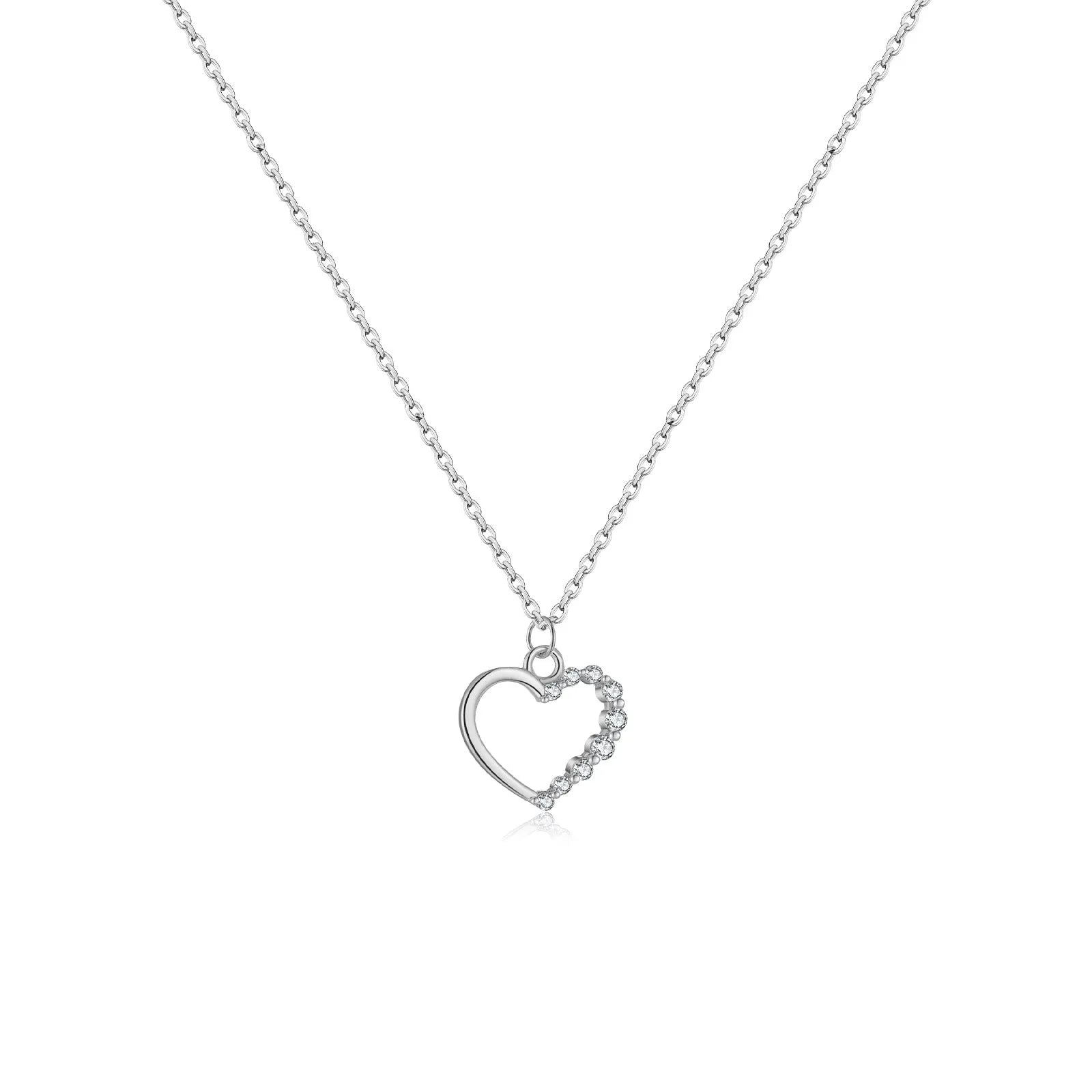 Sterling silver hollow heart necklace with circular details on a regular chain
