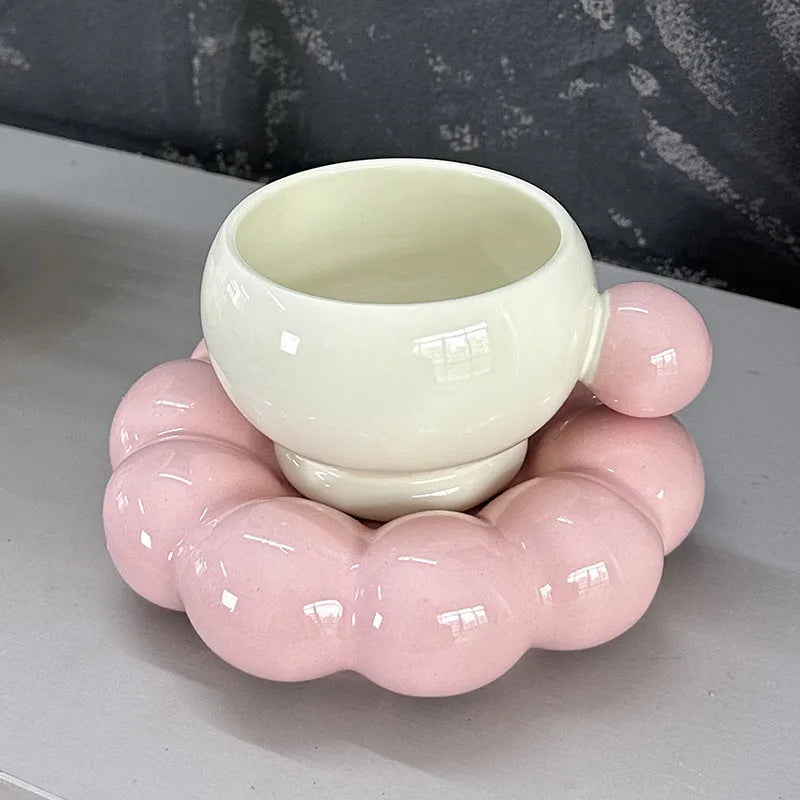 Ceramic coffee cup and dish set in a Nordic style, shown in a choice of solid colours.