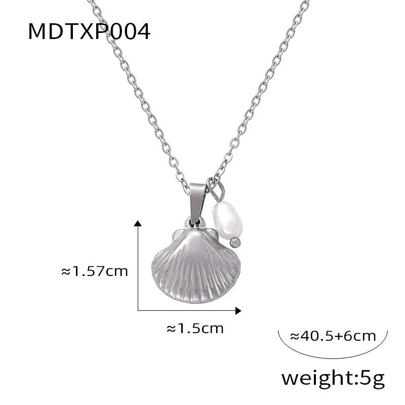 Gold tone women's necklace with shell pendant and freshwater pearl bead on O-chain.
