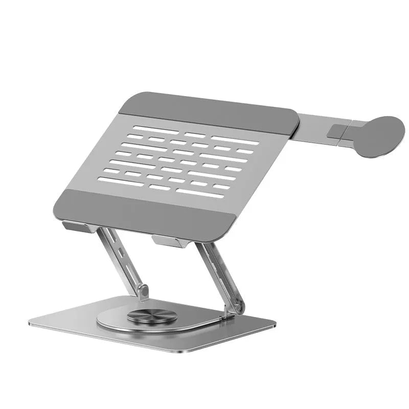 Silver carbon steel laptop stand on a desk, shown rotated with a phone attached to its magnetic holder.