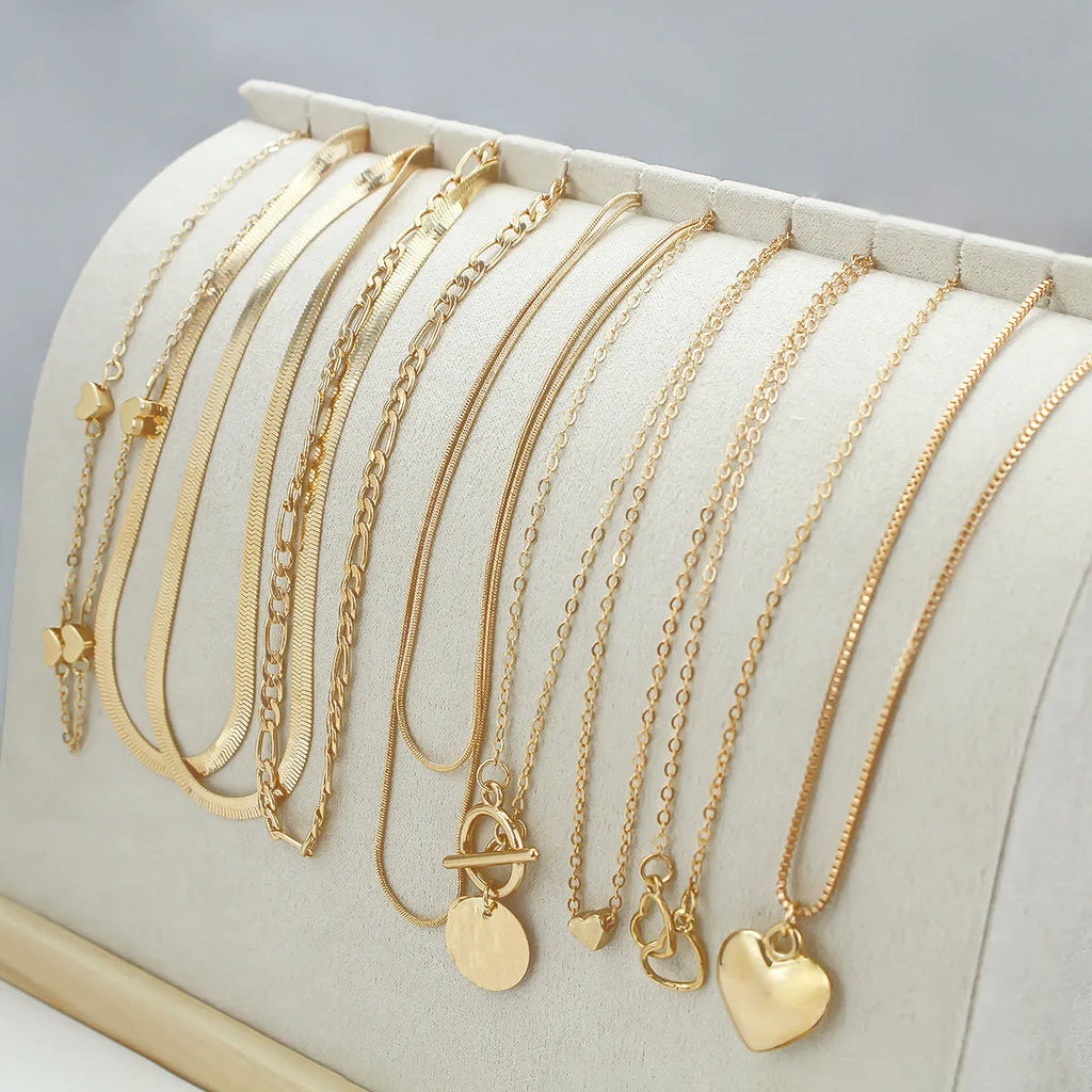 Ten gold electroplated necklaces with alloy pendants on snake bones chains, adjustable 21-50cm length