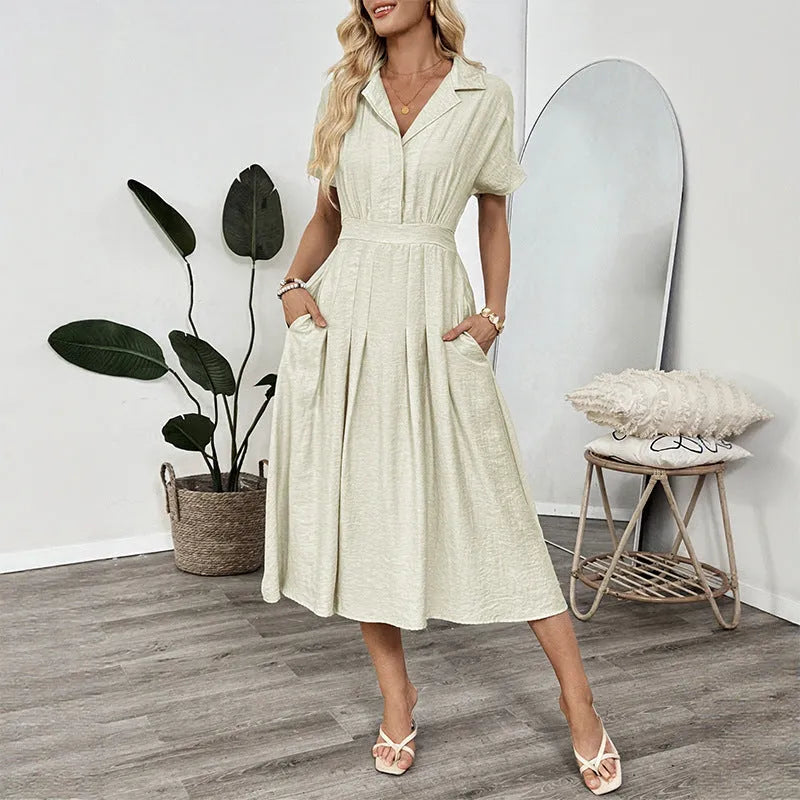 Light green women's shirt dress with lapel collar, waist tie, and skirt pocket on a hanger.