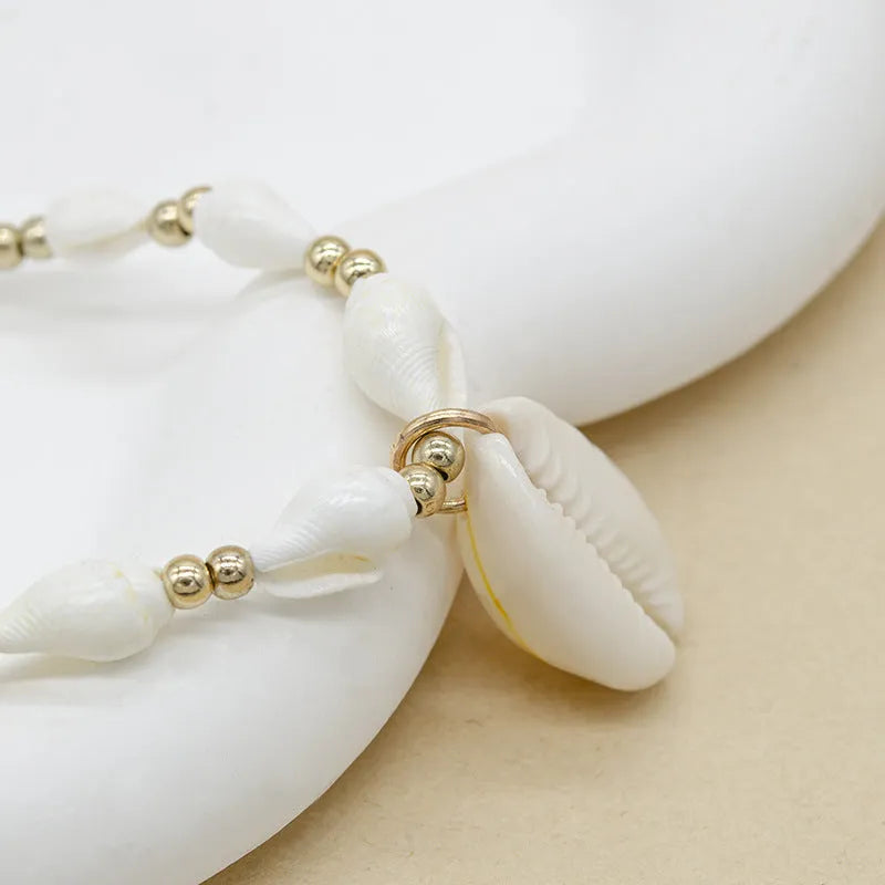 Women's white mother of pearl shell pendant necklace with regular chain on display