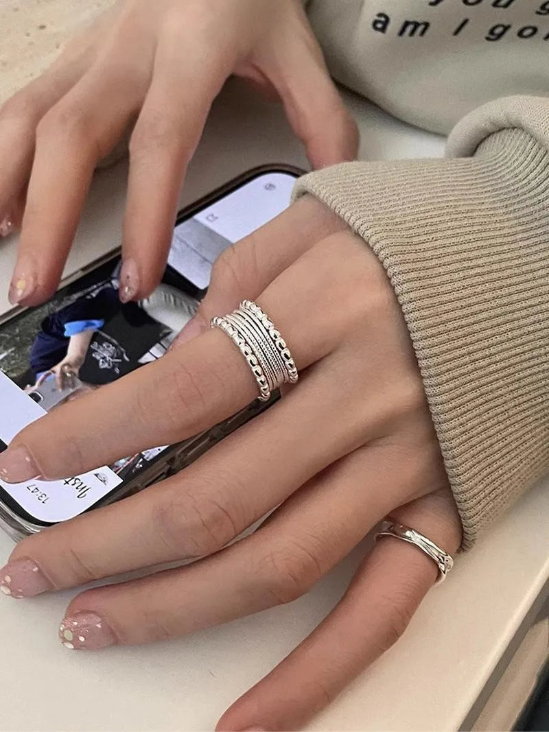 Women's copper alloy ring with woven twisted geometric design and adjustable opening