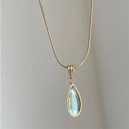 Retro water drop necklace with blue gem inlay on a titanium steel snake bone chain.