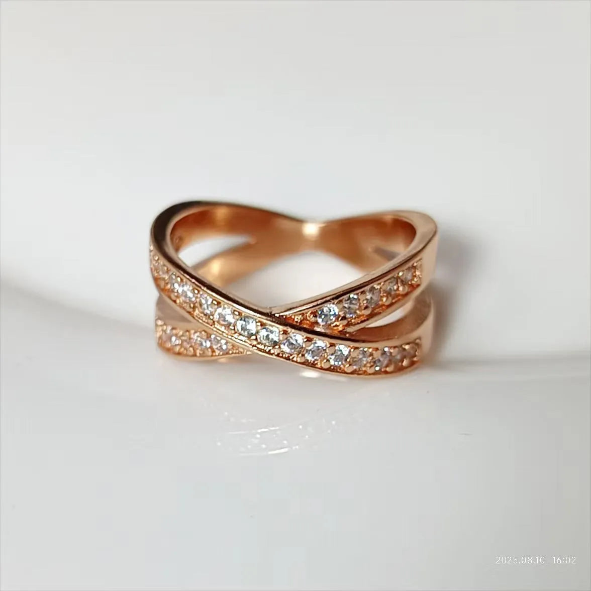 Geometric metal cross ring with micro-inlaid zircon stones in silver or rose gold finish