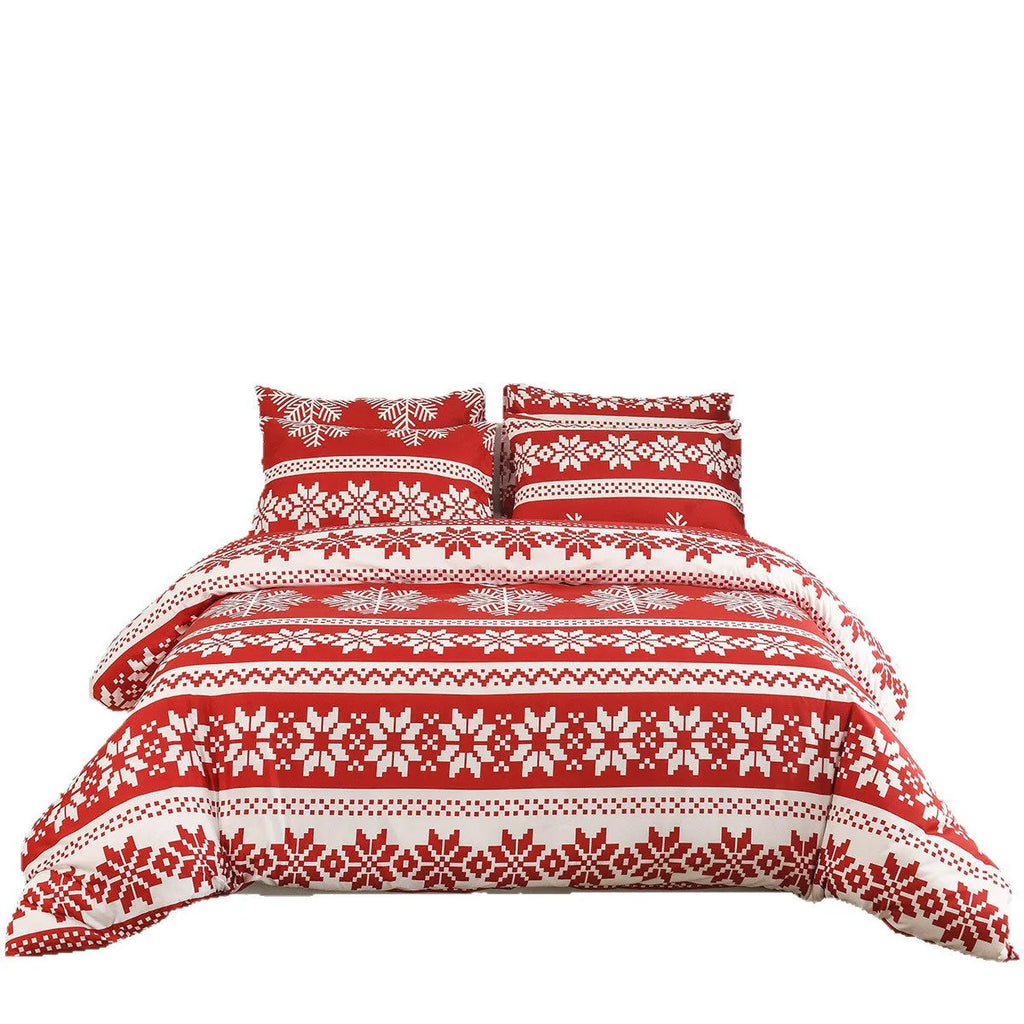 Red Christmas Love Song pattern duvet cover and pillowcases on a bed.