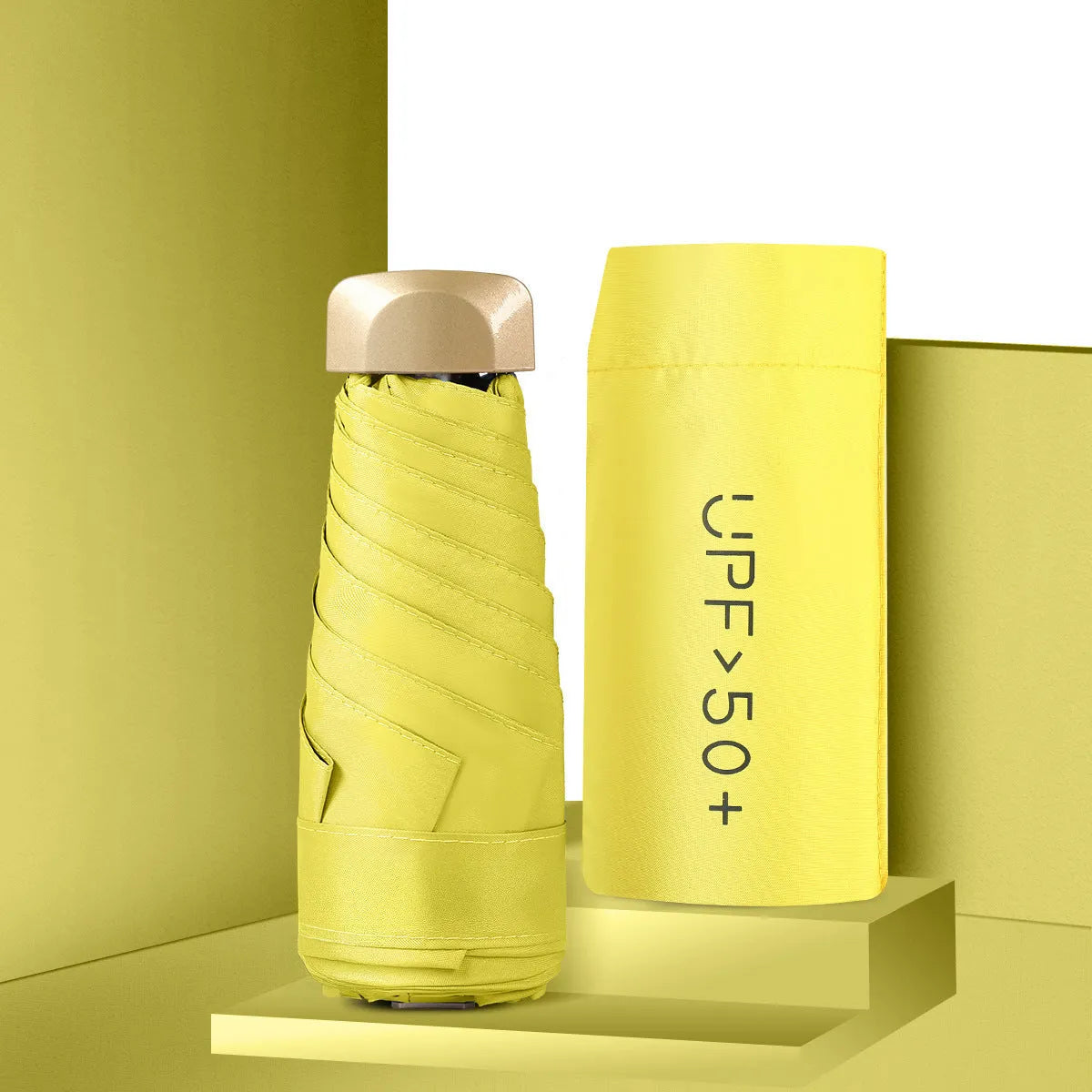 Closed five-fold mini pocket sun umbrella with alloy frame and rubber handle, shown in a selection of available colours.
