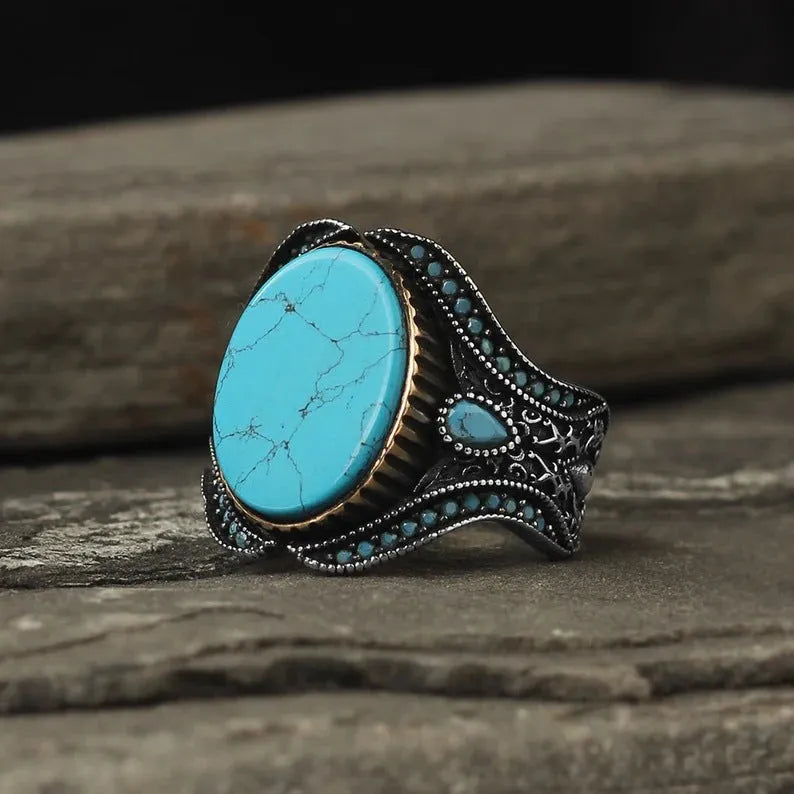 Men's turquoise stone alloy ring with antique silver finish on a round band