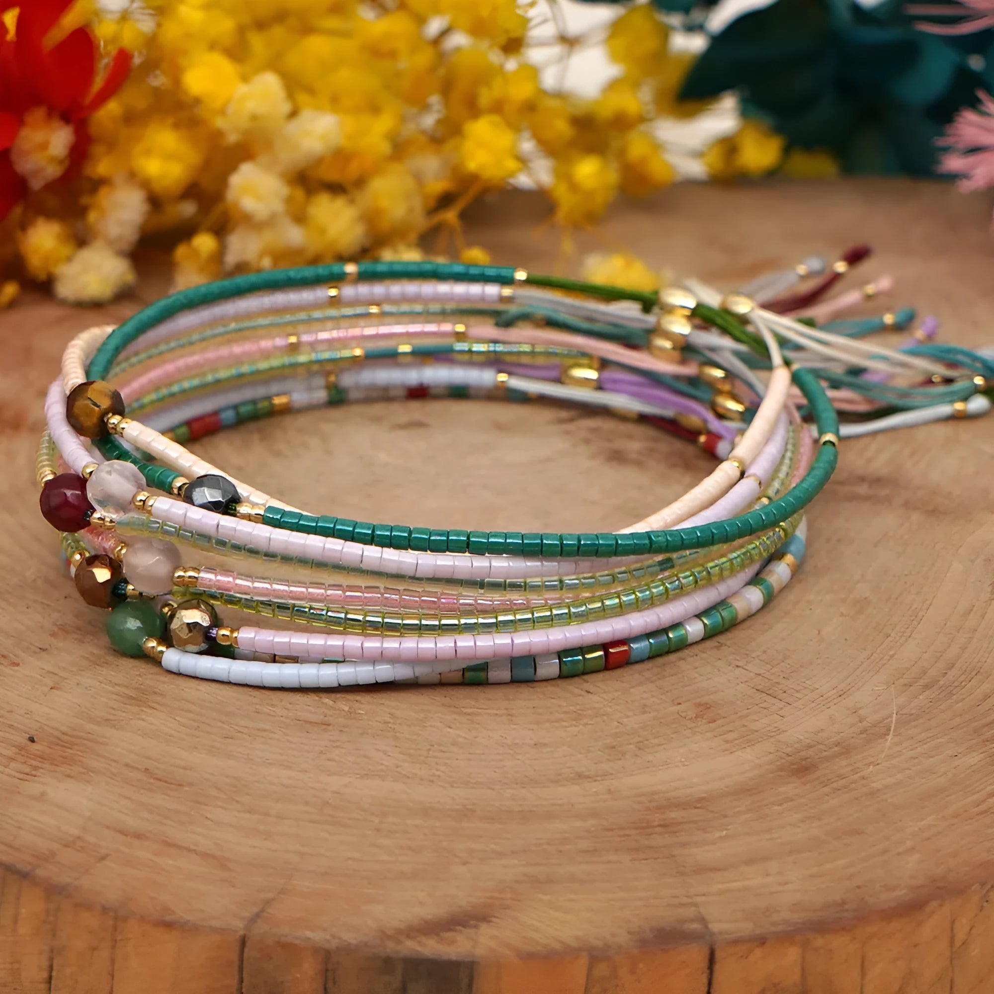 A colourful Bohemian style beaded bracelet with semi-precious stone and glass beads on an adjustable strap.