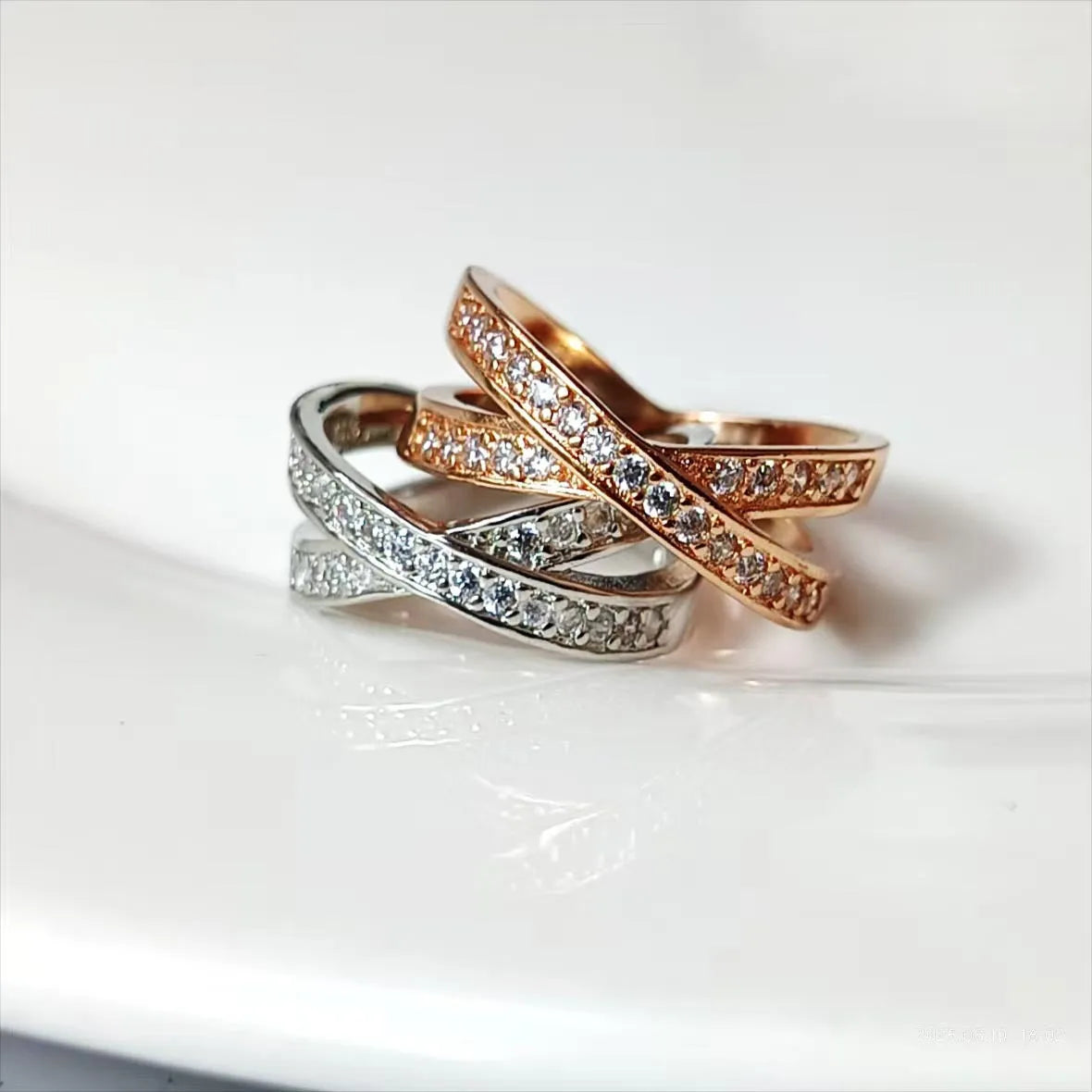 Geometric metal cross ring with micro-inlaid zircon stones in silver or rose gold finish