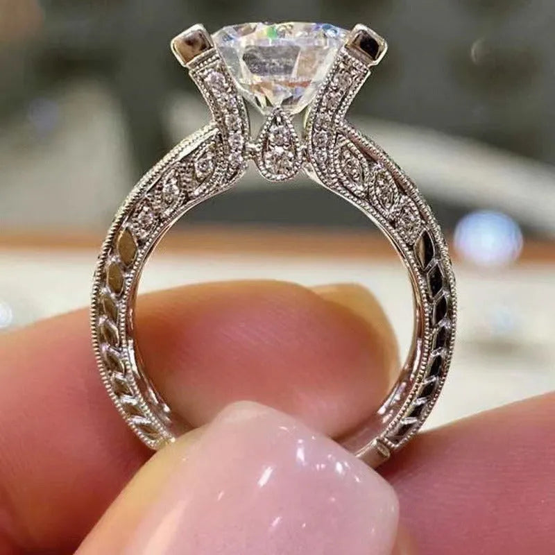 Geometric silver fashion ring for women in gold or white electroplated alloy, showing round design elements.