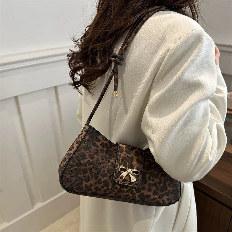 Large casual PU handbag for women in black, shown with sandwich pocket detail.