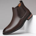 Men's black pointed toe Chelsea boots with a round toe shape and rubber sole.