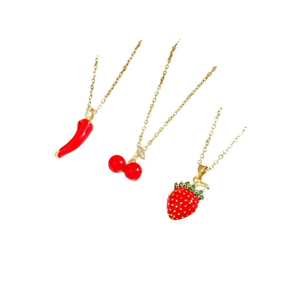 Women's titanium steel necklace with delicate indie pendant designs including strawberry, cherry, and pepper motifs