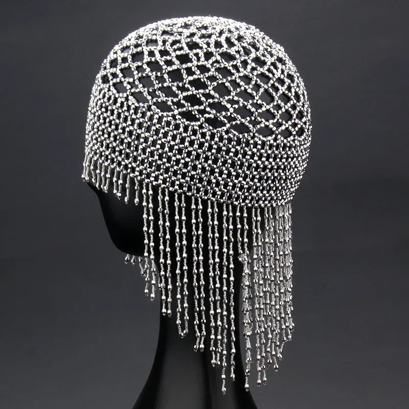 Handmade silver belly dance hat with beaded alloy tile and long black tassels.