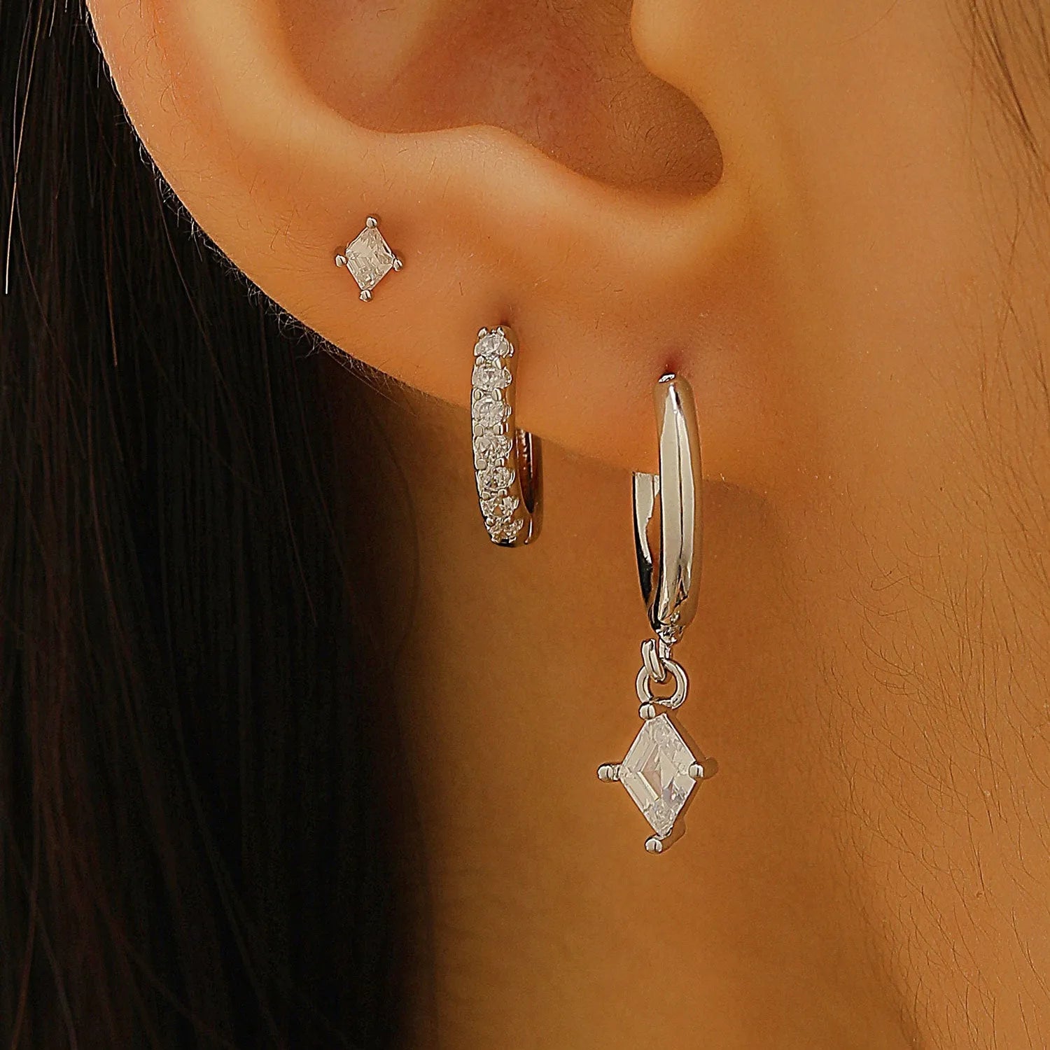 Ladies three-piece geometric earring set with zircon stones in gold and white finish options