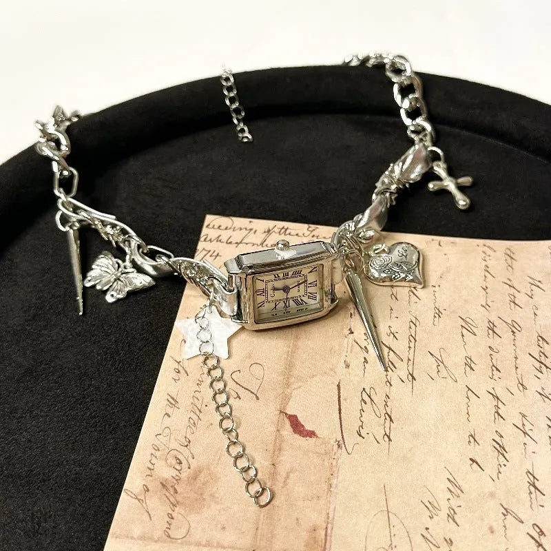 Dark multi-layer necklace with hemp flower chain links and a cross pendant on an adjustable 41-50cm chain.