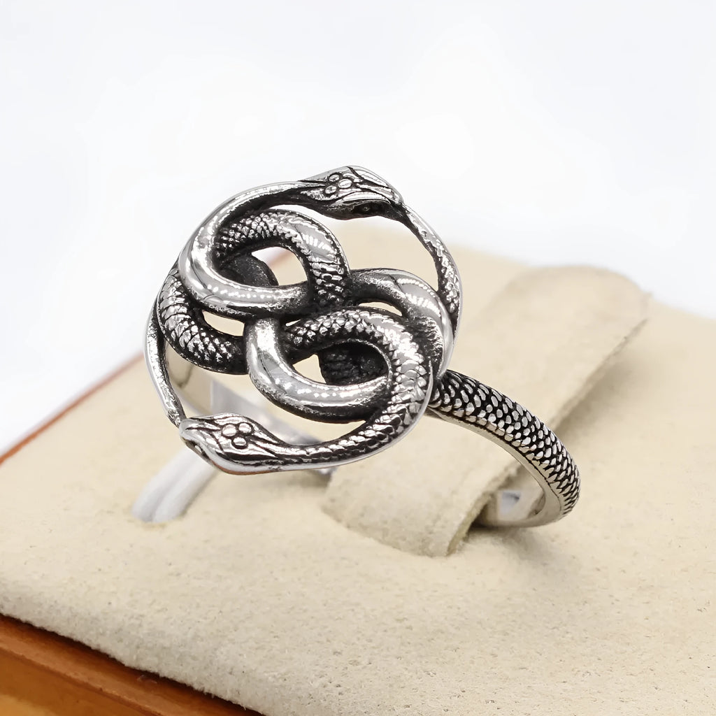 Retro double snake titanium steel ring showing detailed sculptural design on finger