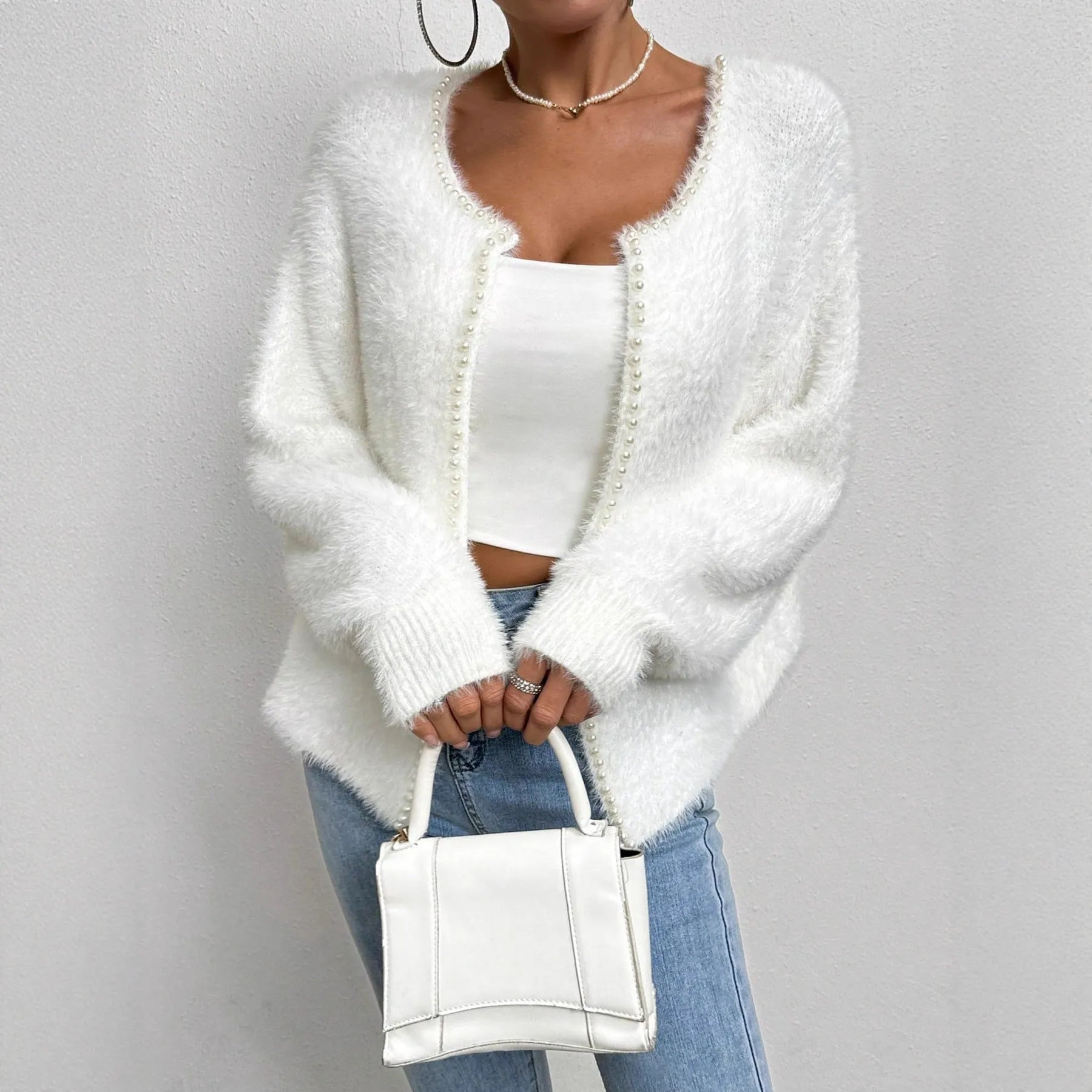 White women's cardigan sweater with V-neck design and beaded knitwork detailing