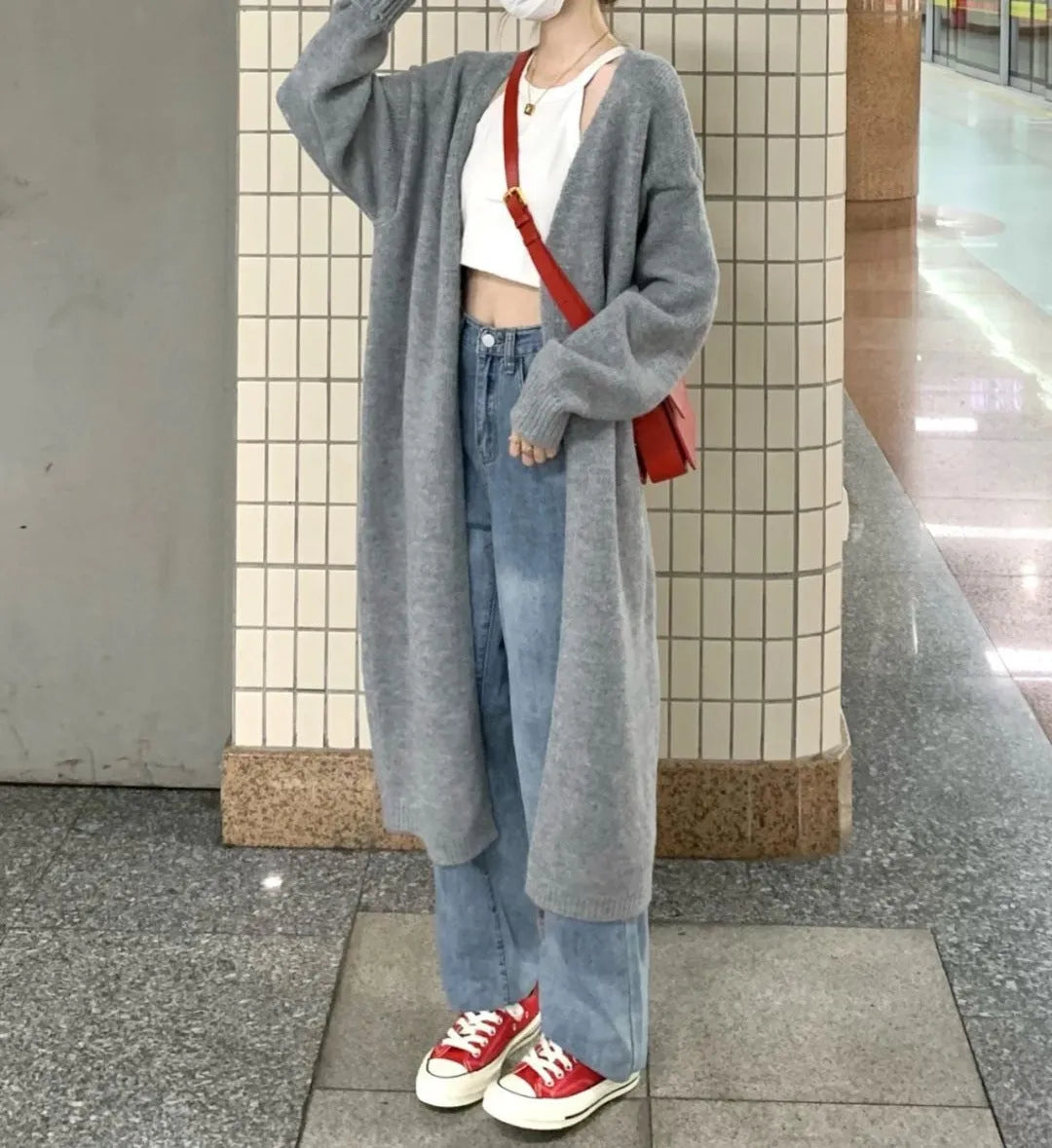 Loose dark grey knitted women's cardigan with 3D pattern texture and open front.