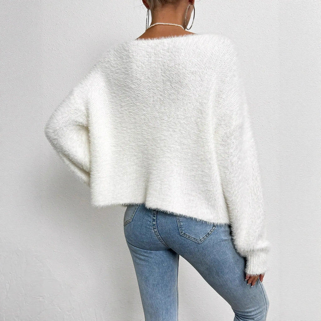 White women's cardigan sweater with V-neck design and beaded knitwork detailing