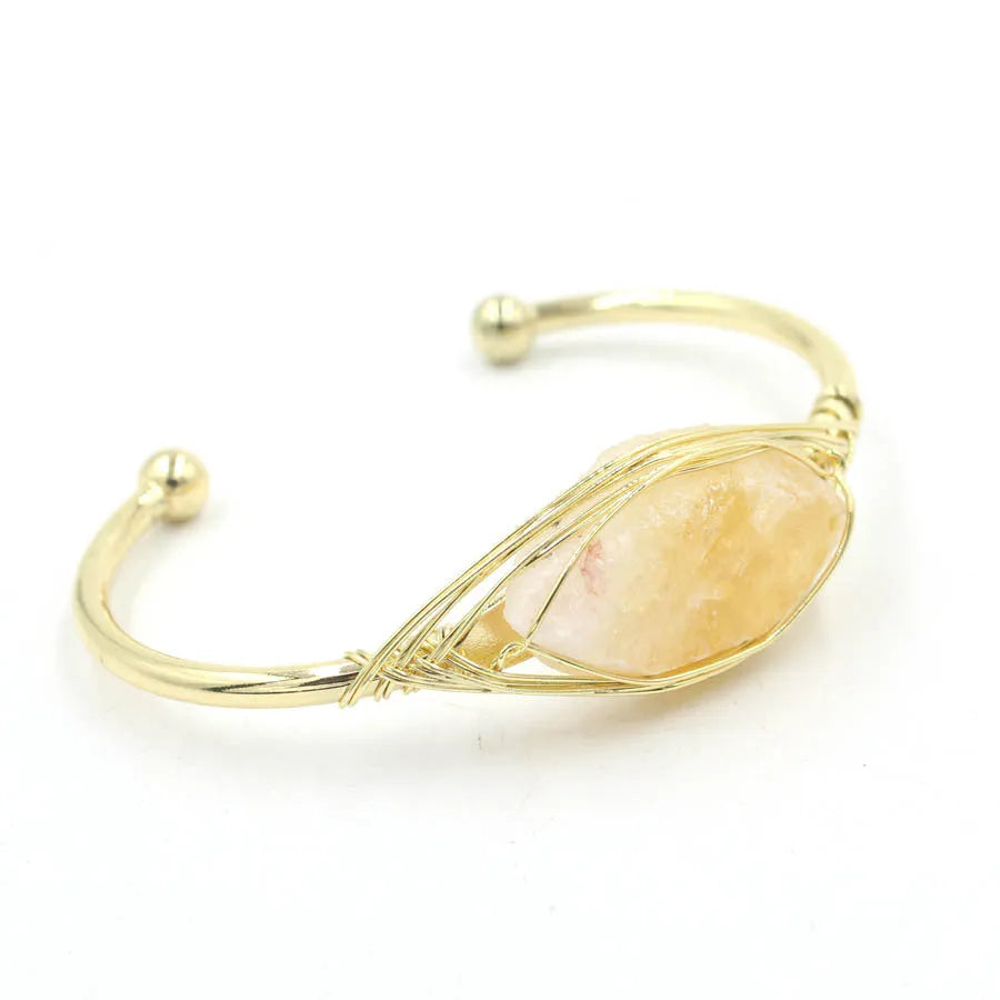 Natural raw gemstone bracelet with 8mm amorphous crystal beads on an adjustable open band.