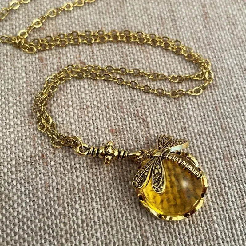 Hand carved dragonfly pendant necklace in vintage bronze finish on sterling silver chain
