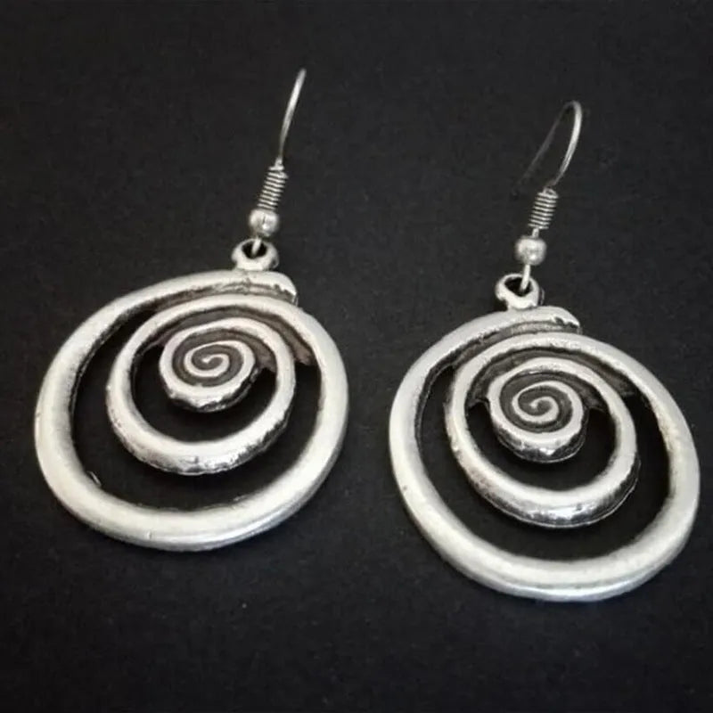 Silver geometric spiral distressed earrings showing alloy construction and 5cm drop length