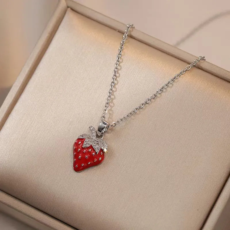 Women's titanium steel necklace with delicate indie pendant designs including strawberry, cherry, and pepper motifs