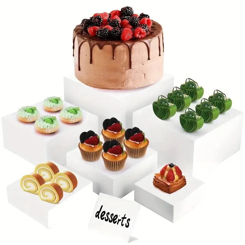 White plastic six-piece suit cube desktop dessert display stand set arranged in tiers.