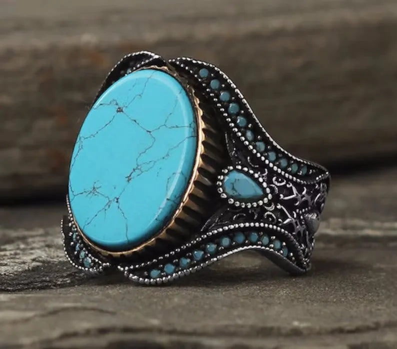 Men's turquoise stone alloy ring with antique silver finish on a round band